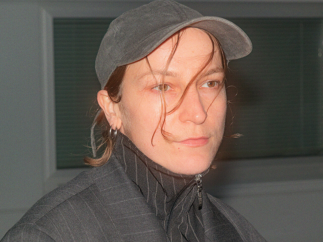 Portrait of Magdalena Forster, wearing a grey cappy.