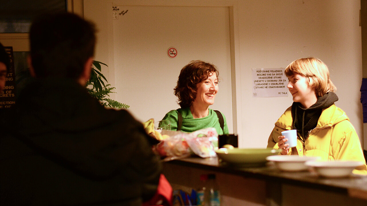 Silvia Marchig & Eliza Trefas chatting at the bar